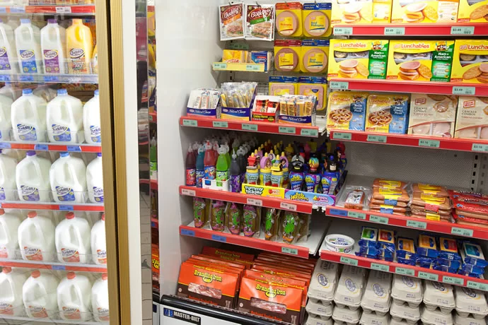 Bread, Milk, Eggs, tortillas, cereal and bacon all a supermarket pricing.